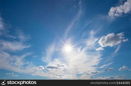 Blue sky with clouds and a bright sun. Blue sky with clouds and bright sun