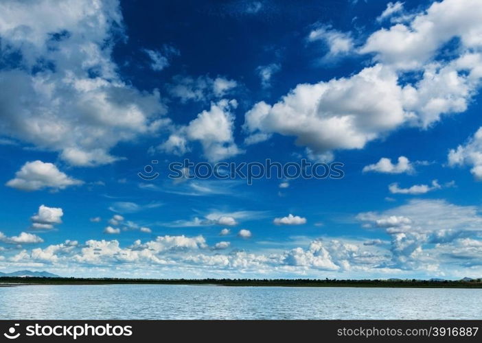 blue sky with clouds and marsh landscape