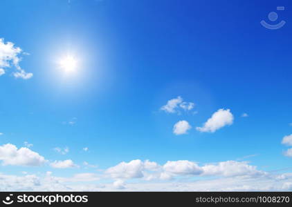 blue sky with clouds and sun