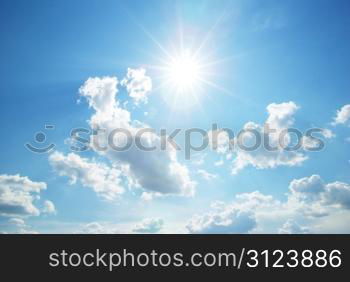 Blue sky with clouds and sun