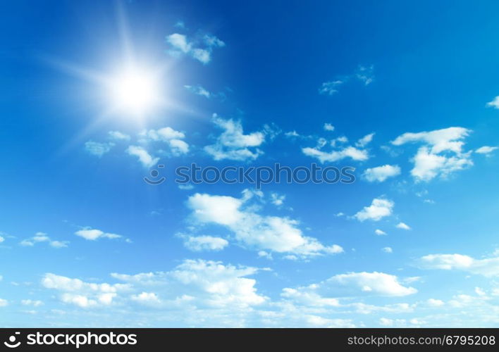 Blue sky with clouds and sun.