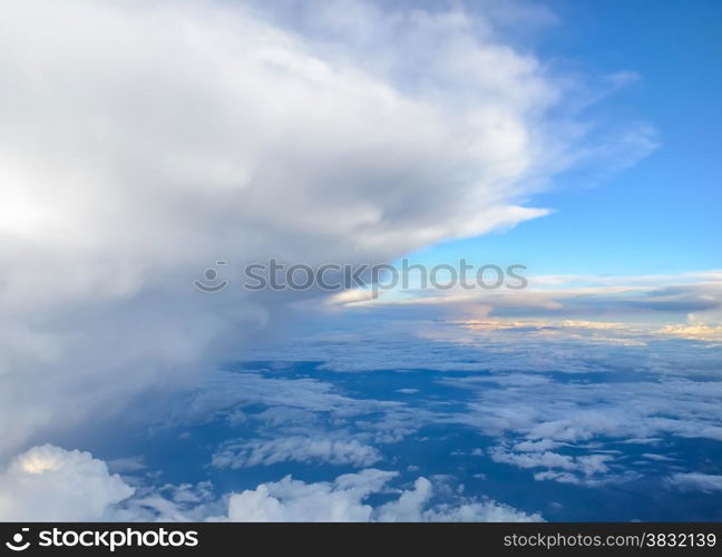 Blue sky with clouds background. View from airplane