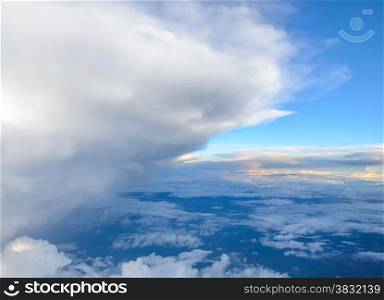 Blue sky with clouds background. View from airplane