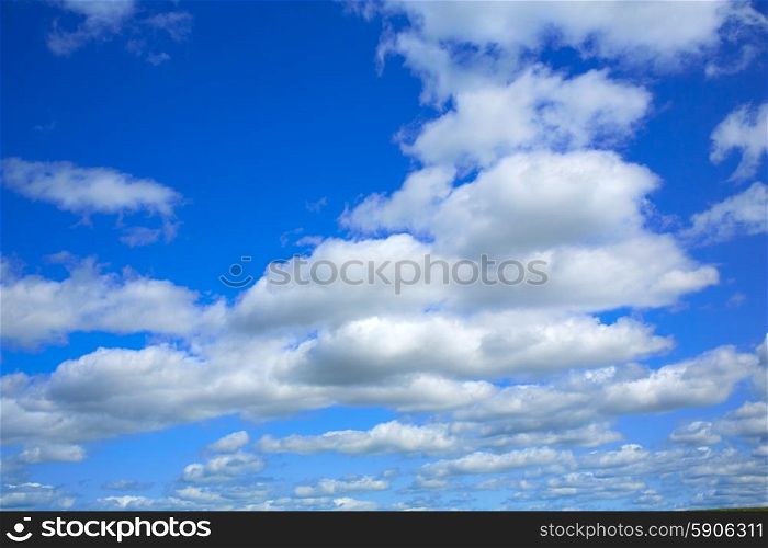 Blue sky with clouds in a summer day with dramatic shapes