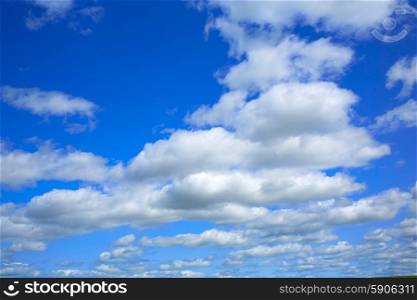 Blue sky with clouds in a summer day with dramatic shapes