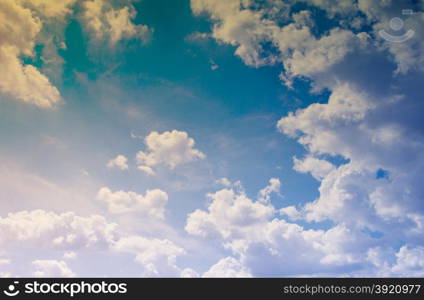 Blue sky with clouds in grunge style.