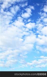 Blue sky with clouds - may be used as vertical background
