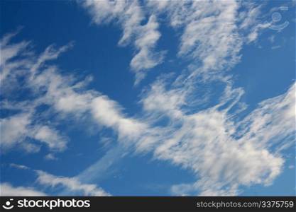 Blue sky with clouds, which are located diagonally