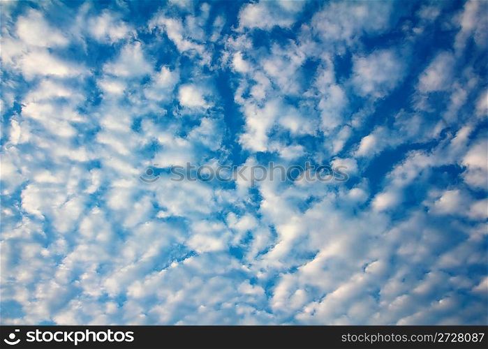 blue sky with fleecy clouds background