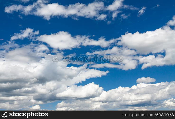 Blue sky with small white clouds