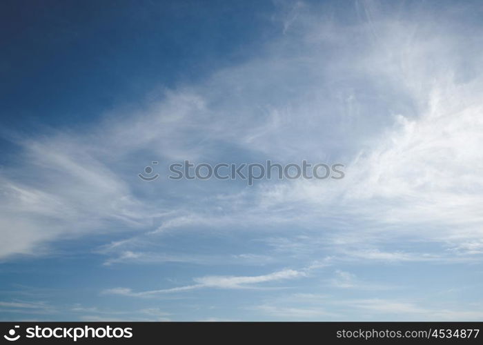 Blue sky with soft white clouds in the summer