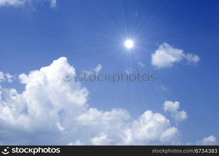 Blue sky with sun and beautiful clouds.