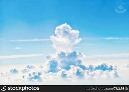 Blue sky with white clouds, above aerial view from a plane, nature blue sky background
