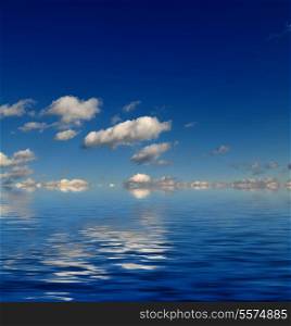blue sky with white clouds and abstract water reflection in nature background