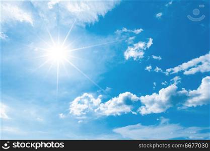 Blue sky with white clouds and shiny sun. Blue sky with clouds and sun