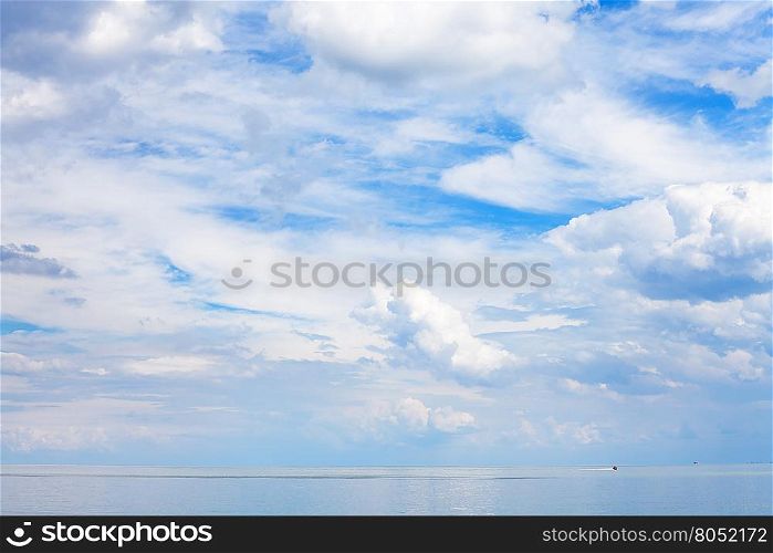 blue sky with white clouds over calm water Sea of Azov, Temryuk bay, Golubitskaya resort, Taman peninsula, Kuban, Russia
