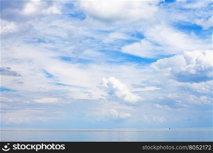 blue sky with white clouds over calm water Sea of Azov, Temryuk bay, Golubitskaya resort, Taman peninsula, Kuban, Russia