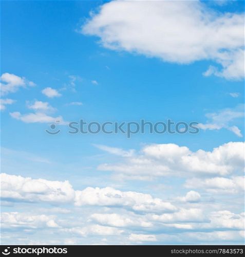 blue sky with white fluffy clouds in may