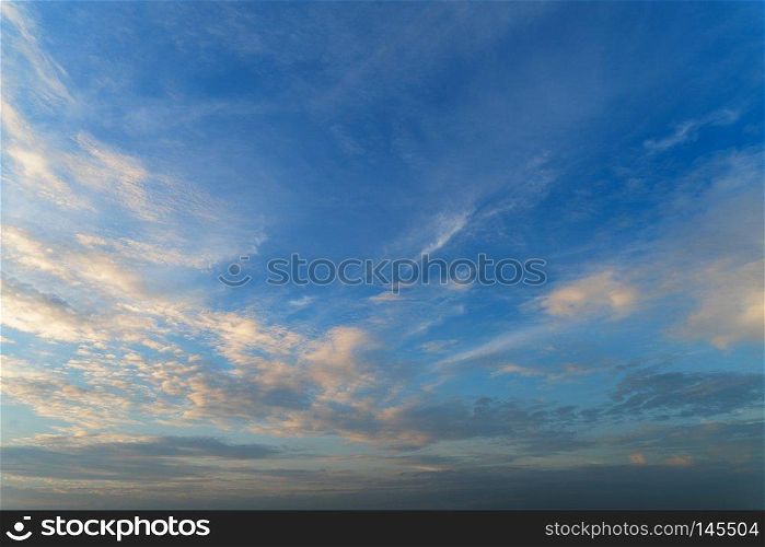 Blue sky with yellow colorful sunset clouds in twilight time