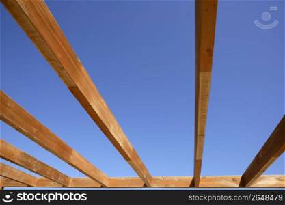 blue sky wooden golden awning beams in summer beach