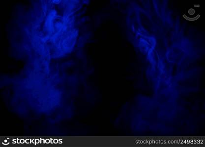 Blue smoke clouds on black, abstract background