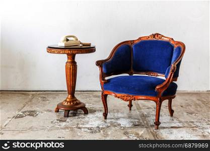 Blue sofa couch in vintage room with vintage telephone - classical style
