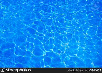 Blue sparkling water in swimming pool