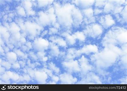 Blue spring sky with clouds, may be used as background