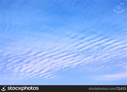 Blue spring sky with clouds - may be used as background