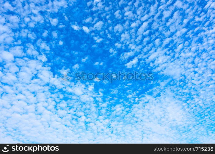 Blue spring sky with plenty small white clouds - Natural background