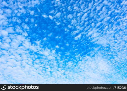 Blue spring sky with plenty small white clouds - Natural background