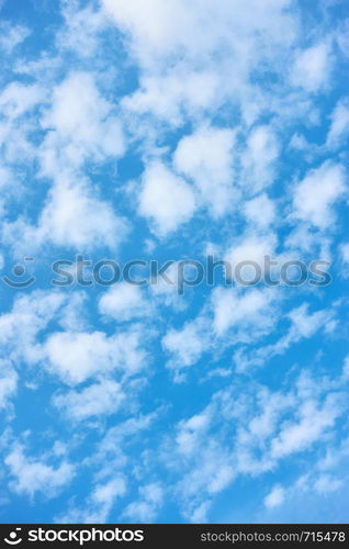 Blue spring sky with white clouds - natural textured background