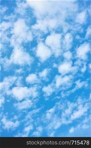 Blue spring sky with white clouds - natural textured background