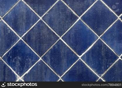 Blue square tiles. Formation on the wall.water and dirt stain.