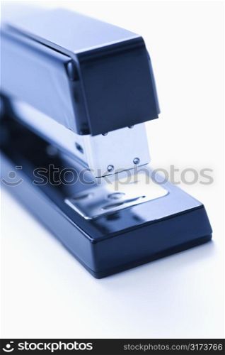Blue stapler on white background.