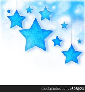 Blue stars, Christmas tree ornaments and holiday decorations, winter border with bokeh lights and white text space