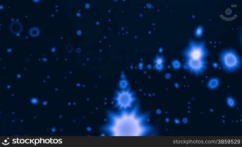 Blue stars slowly fly against a dark background