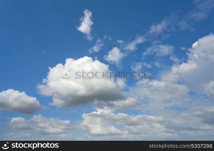 Blue summer sky white cumulus clouds background