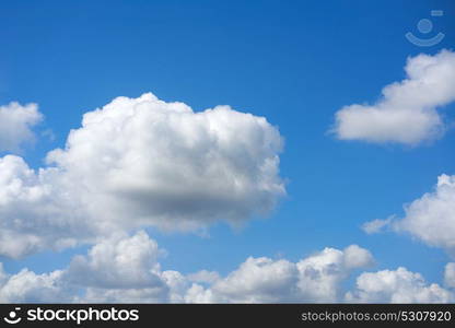 Blue summer sky white cumulus clouds background