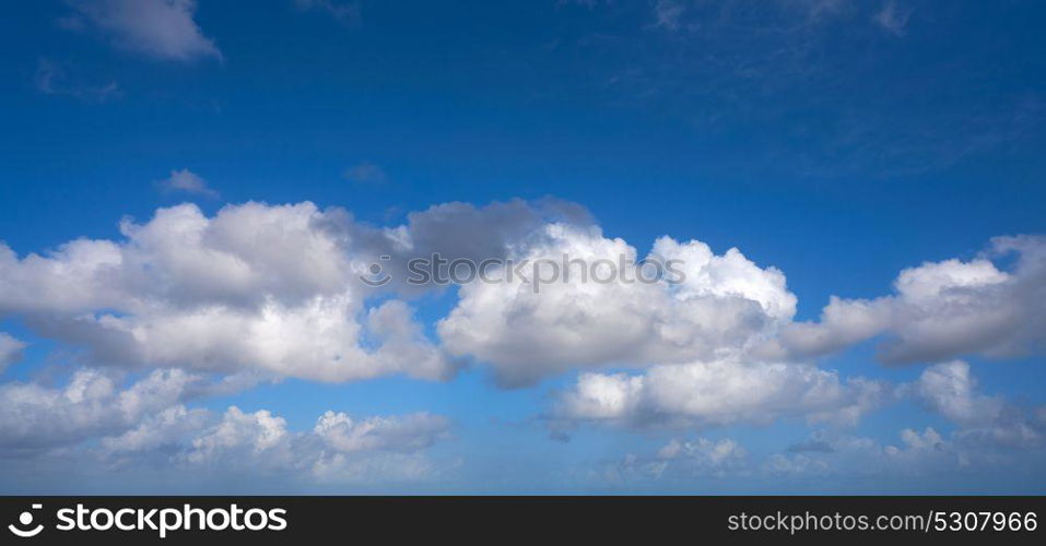 Blue summer sky white cumulus clouds background