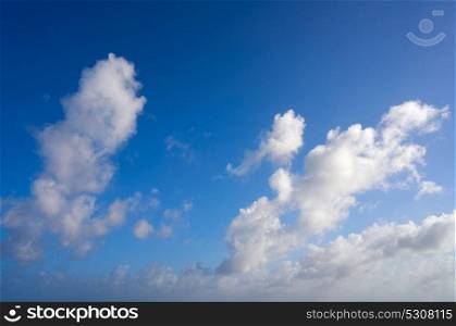 Blue summer sky white cumulus clouds background