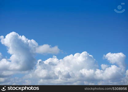 Blue summer sky white cumulus clouds background