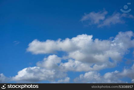 Blue summer sky white cumulus clouds background