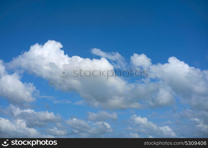 Blue summer sky white cumulus clouds background