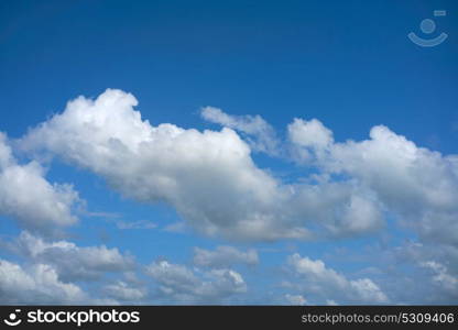 Blue summer sky white cumulus clouds background