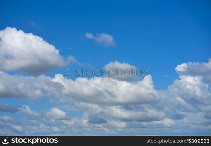 Blue summer sky white cumulus clouds background