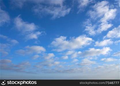 Blue summer sky with white clouds background