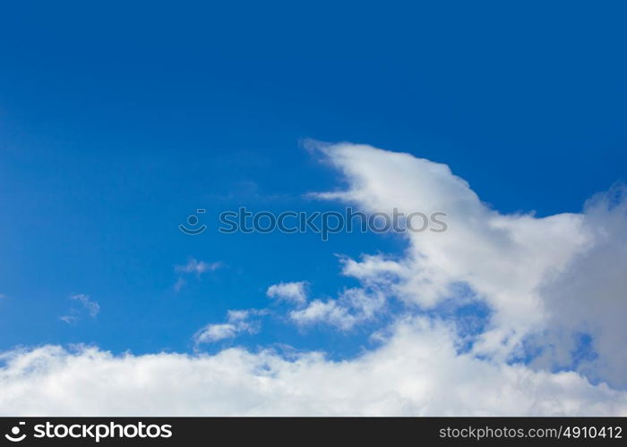 Blue sunny sky with white clouds background