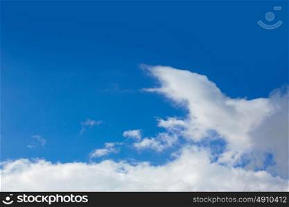 Blue sunny sky with white clouds background