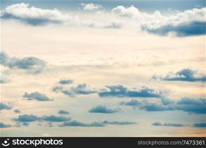 Blue sunset sky background with white clouds